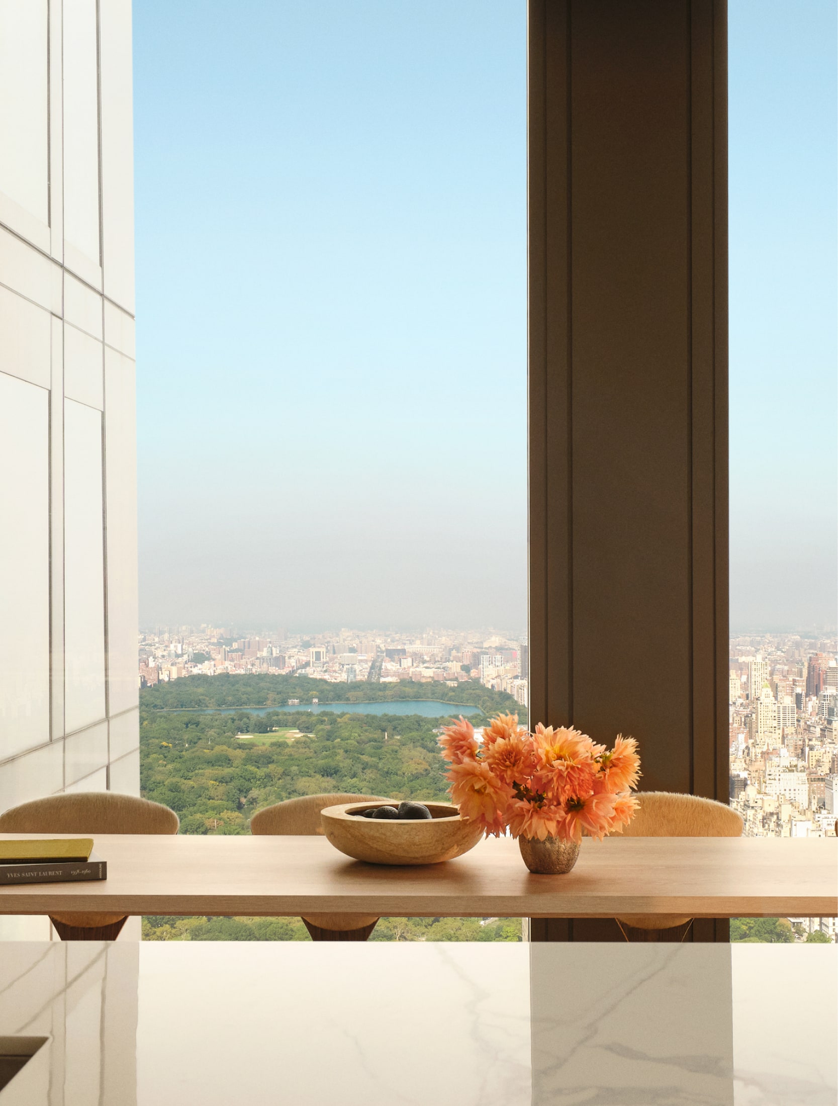 Close up of a table in a light-filled luxury penthouse for sale